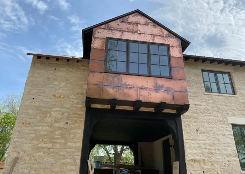 Copper metal panel facade on a stone building for Metal Roof Coating in Valrico