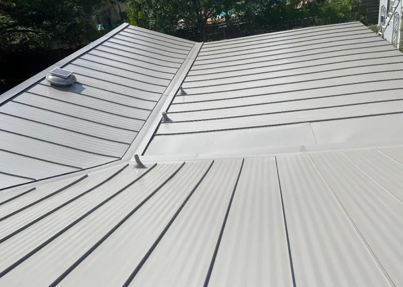 Solar attic fan installed on a metal roof for Roof Ventilation in Valrico